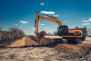 The excavator does earthwork. Digging a pit.